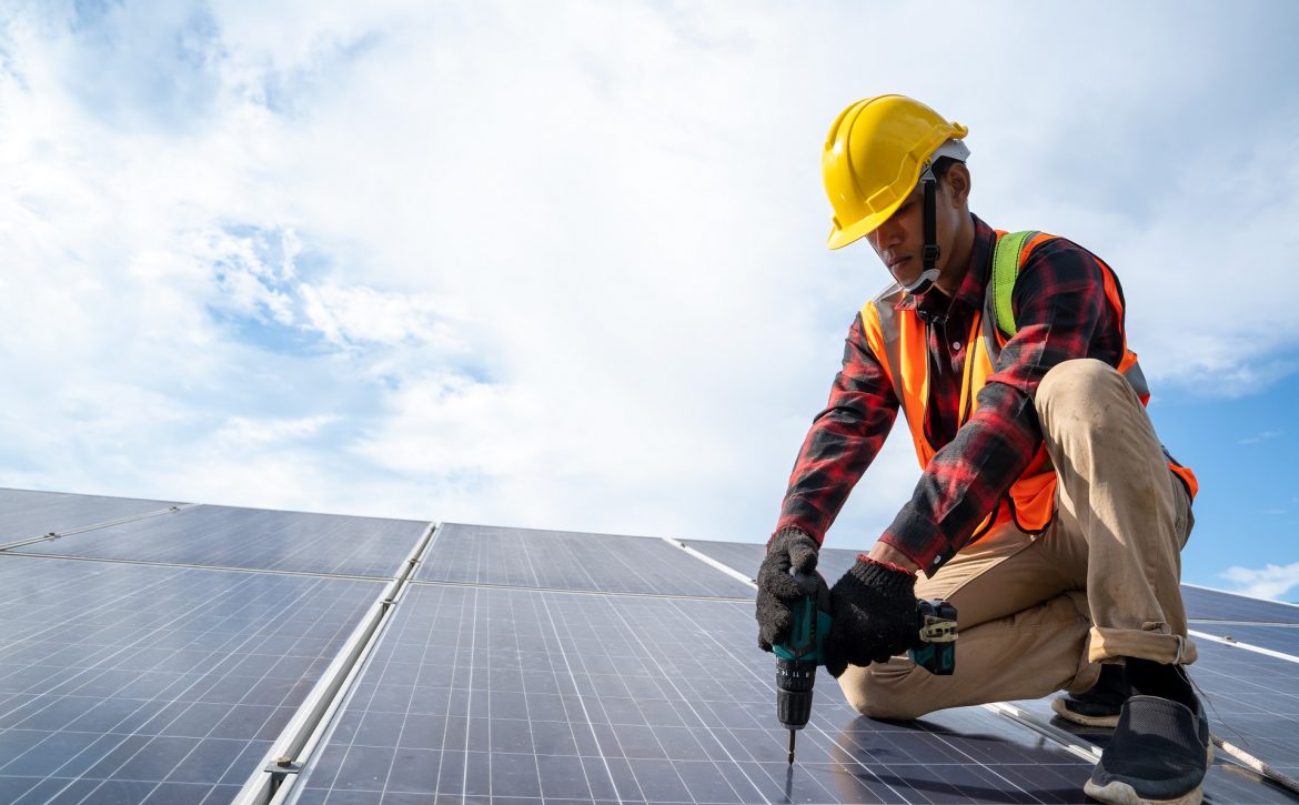 Professional worker working and installing solar panels,Innovati